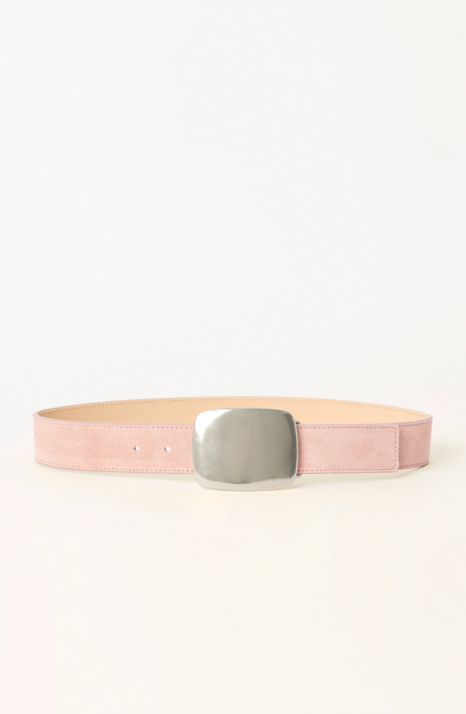 Pink belt with a large silver buckle on a white background