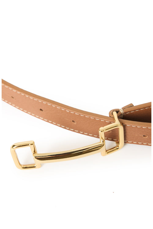 zoomed in image of cognac leather belt with gold buckle